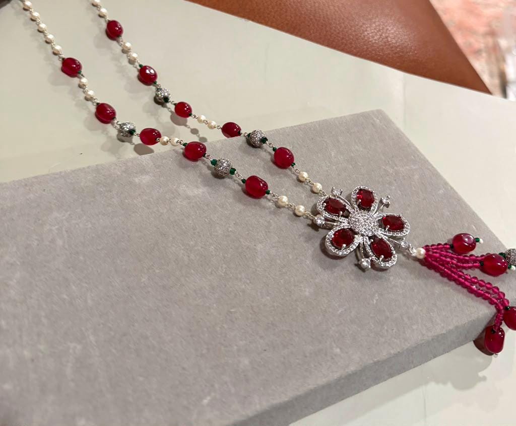 Bohemian Tassel Pendant Necklace with Ruby Pink Beads, Floral Motif and Sparkling Rhodium Finish