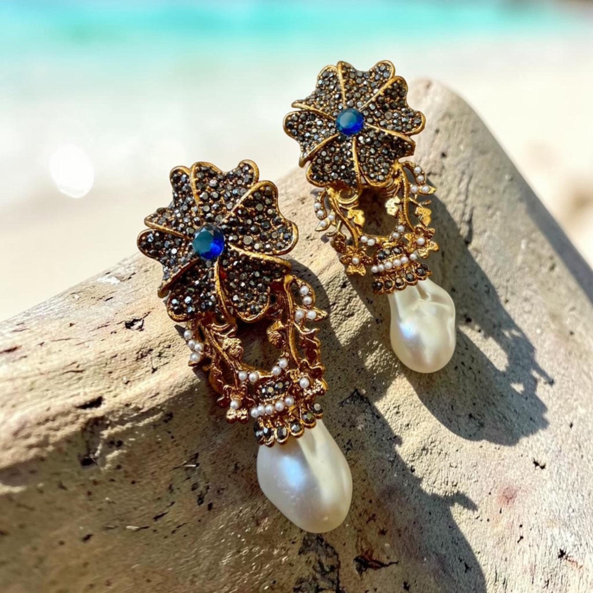 Sapphire Blue Floral Drop Earrings with AD Stones and Gold Tone Finish Statement