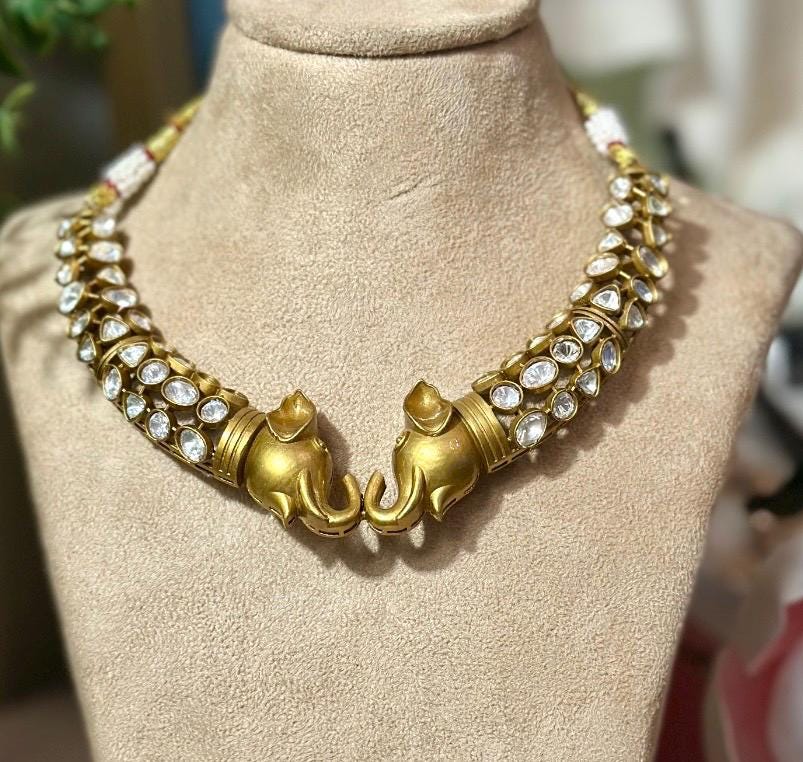 Bollywood ethnic Indian gold finish set with stones.