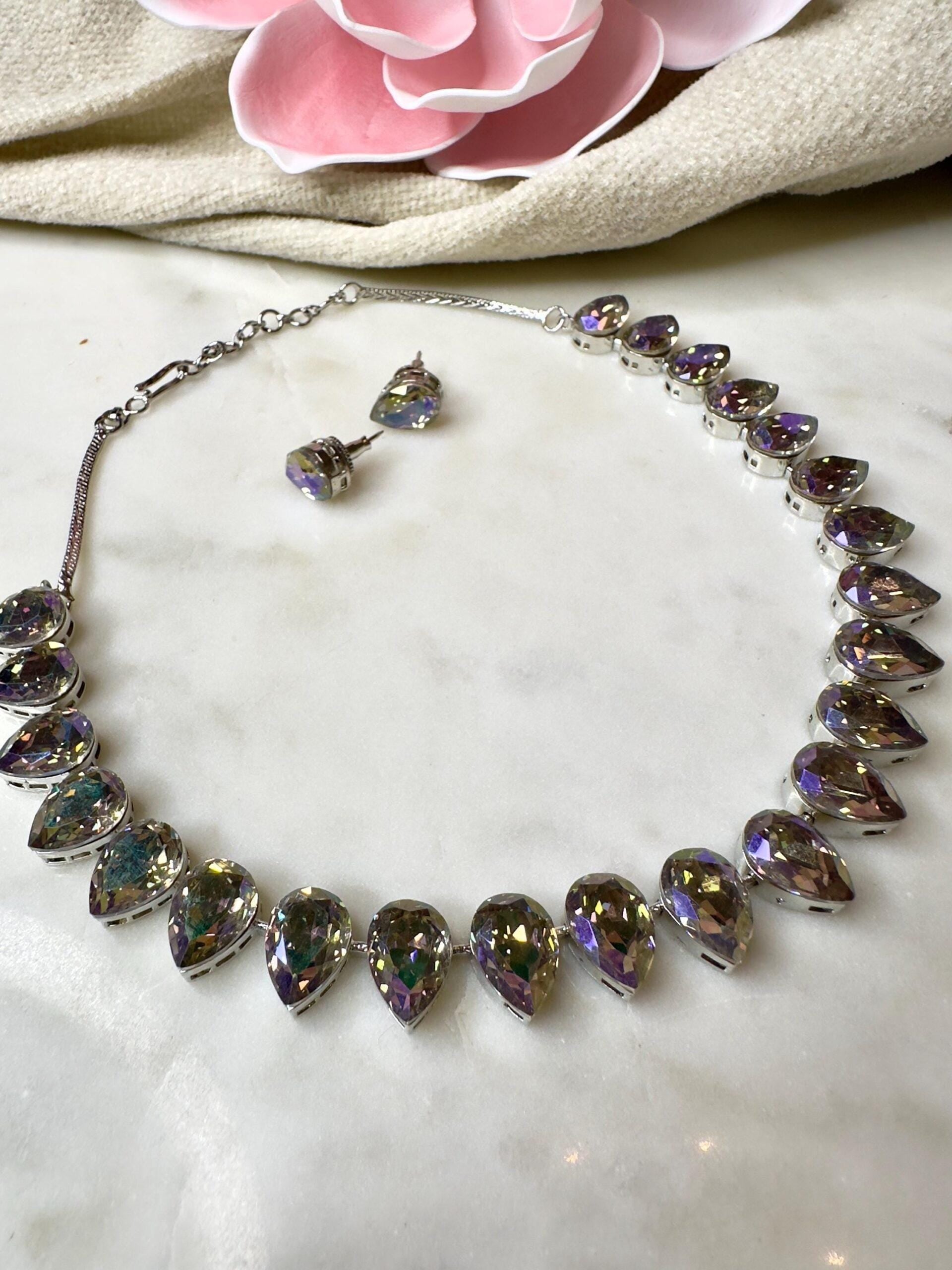beautifully crafted Sworaski crystals necklace set with studs/wedding /silver plated/rhodium finish adjustable.