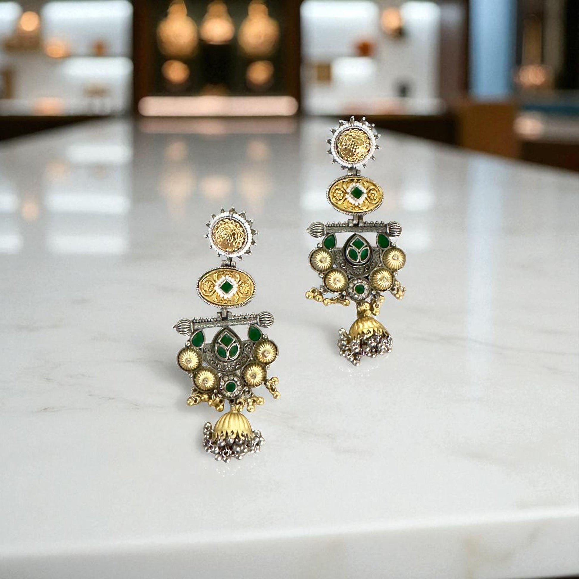 Bollywood Style Traditional Dual-Tone Earrings with Green Stones & Jhumka Design