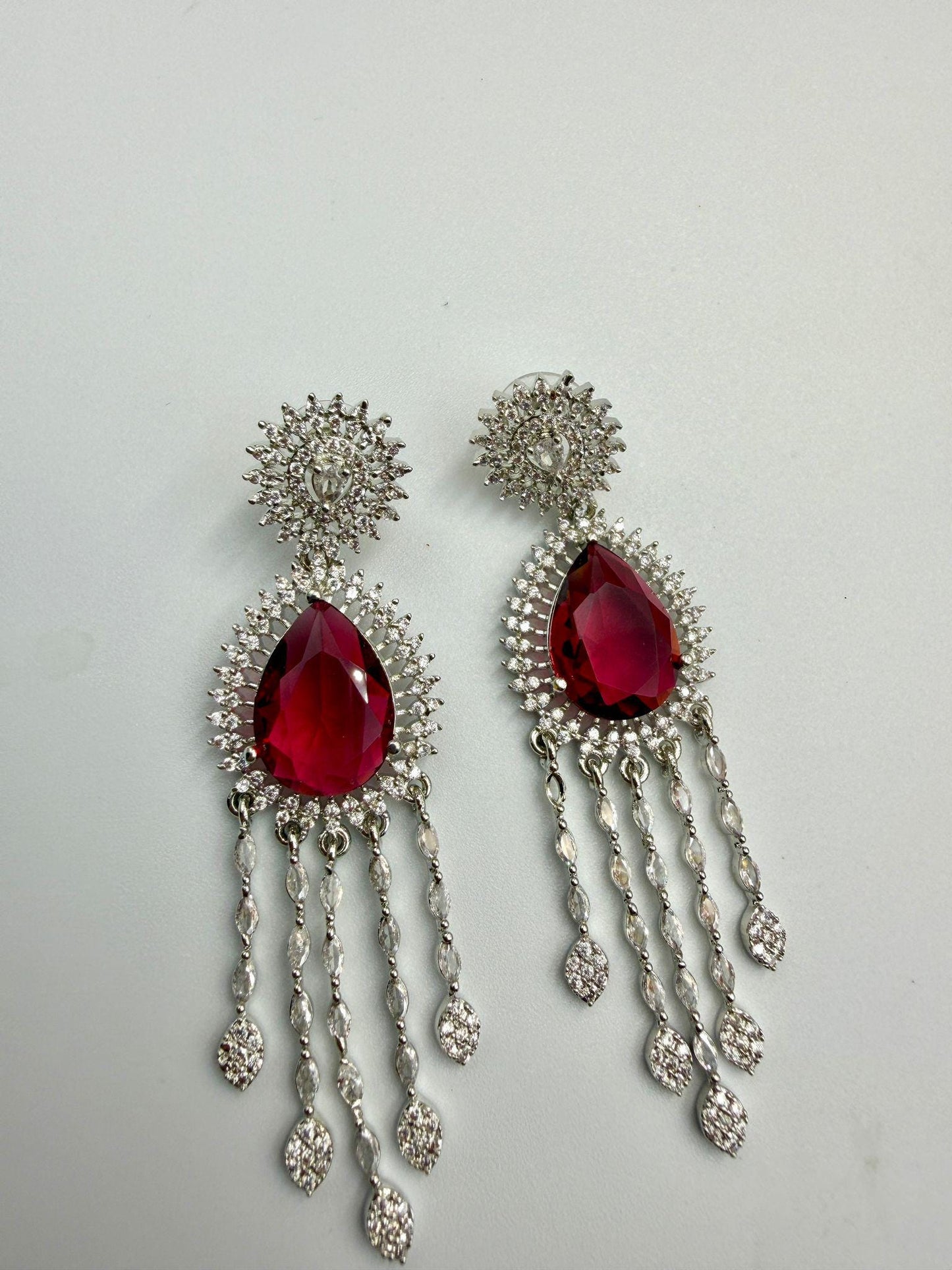 Luxury Ad Ruby Red Dangle Earrings with Sparkling Diamond Accents.