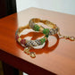 Jada Nauratan Kada Set Openable - Exquisite Gold Bangles with Red, Green, and White Gemstones