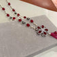 Bohemian Tassel Pendant Necklace with Ruby Pink Beads, Floral Motif and Sparkling Rhodium Finish