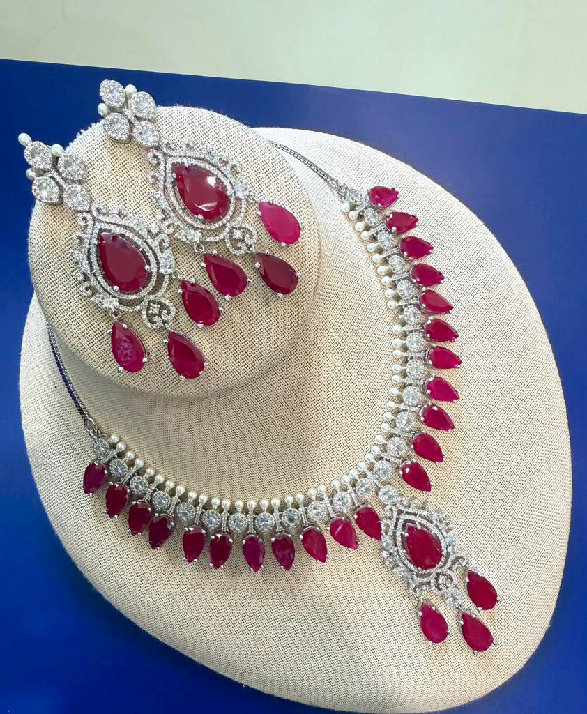 Elegant Highend designer Silver Tone Jewelry Set with Ruby Red Stones for Receptions and Occasions Statement piece