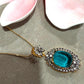Gold Plated Statement Necklace with Aqua Blue Oval Pendant, CZ Detailing