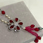 Bohemian Tassel Pendant Necklace with Ruby Pink Beads, Floral Motif and Sparkling Rhodium Finish