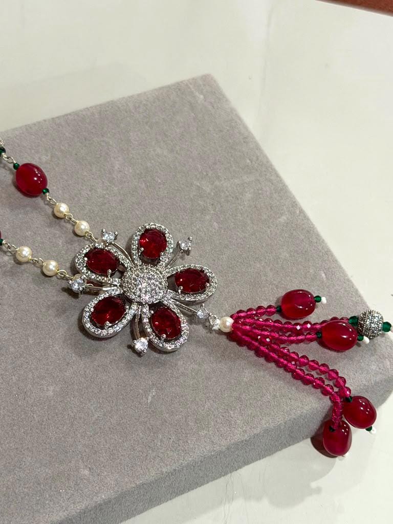 Bohemian Tassel Pendant Necklace with Ruby Pink Beads, Floral Motif and Sparkling Rhodium Finish