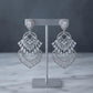 Glamorous Statement Drop Earrings with Decorative Openwork and Pear Accents
