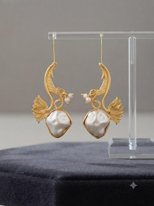 Gold Tone Finish Botanical Earrings with barouk pearl Sculptural Leaf Design and Modern Style