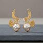 Gold Tone Finish Botanical Earrings with barouk pearl Sculptural Leaf Design and Modern Style