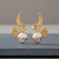 Gold Tone Finish Botanical Earrings with barouk pearl Sculptural Leaf Design and Modern Style