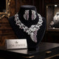 Blush Pink Statement Necklace with Leaf Inspired Details and Accompanying Earrings