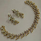 Elegant Antique Gold Finish Leaf Necklace and Earrings Set with Dazzling AD Stone Embellishment