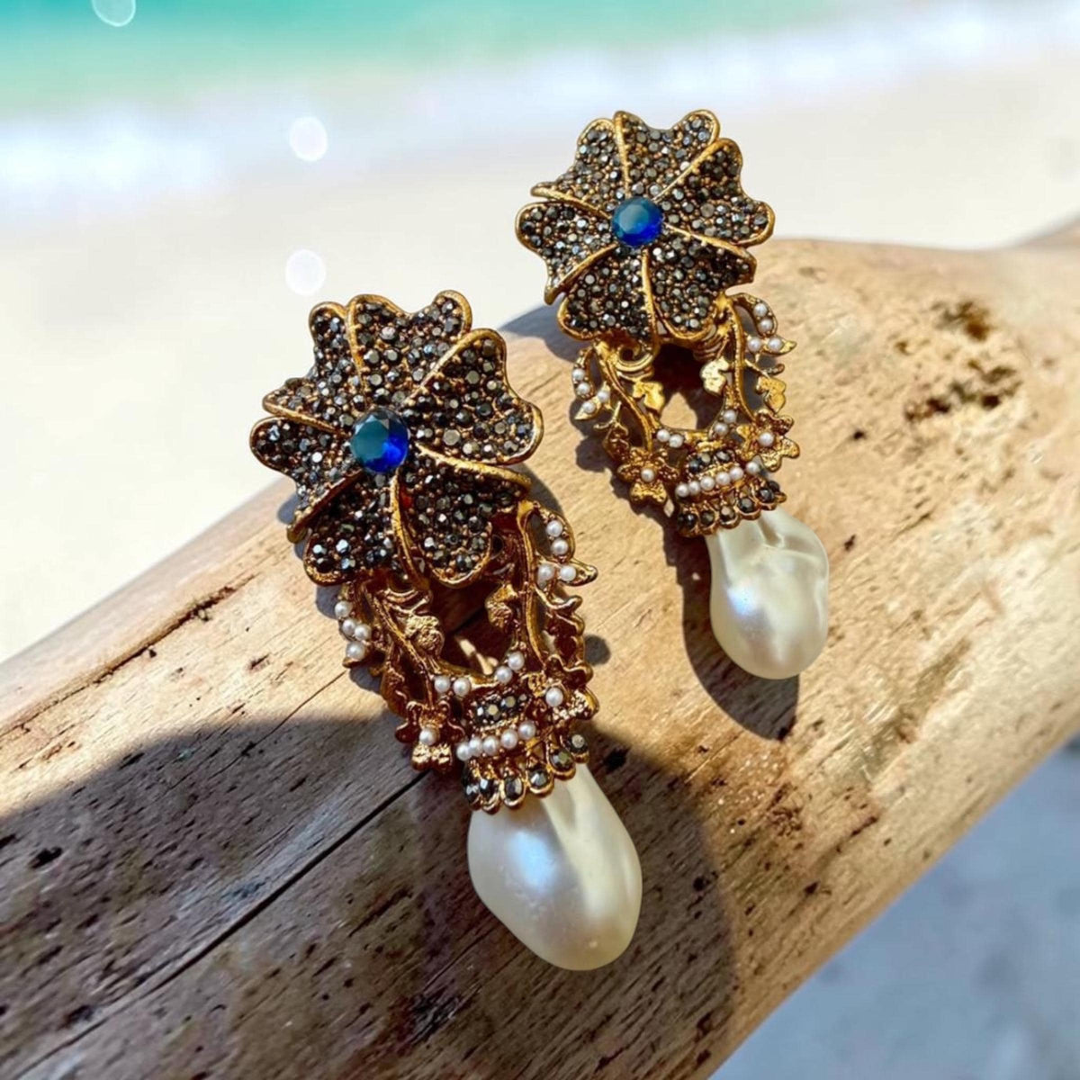 Sapphire Blue Floral Drop Earrings with AD Stones and Gold Tone Finish Statement